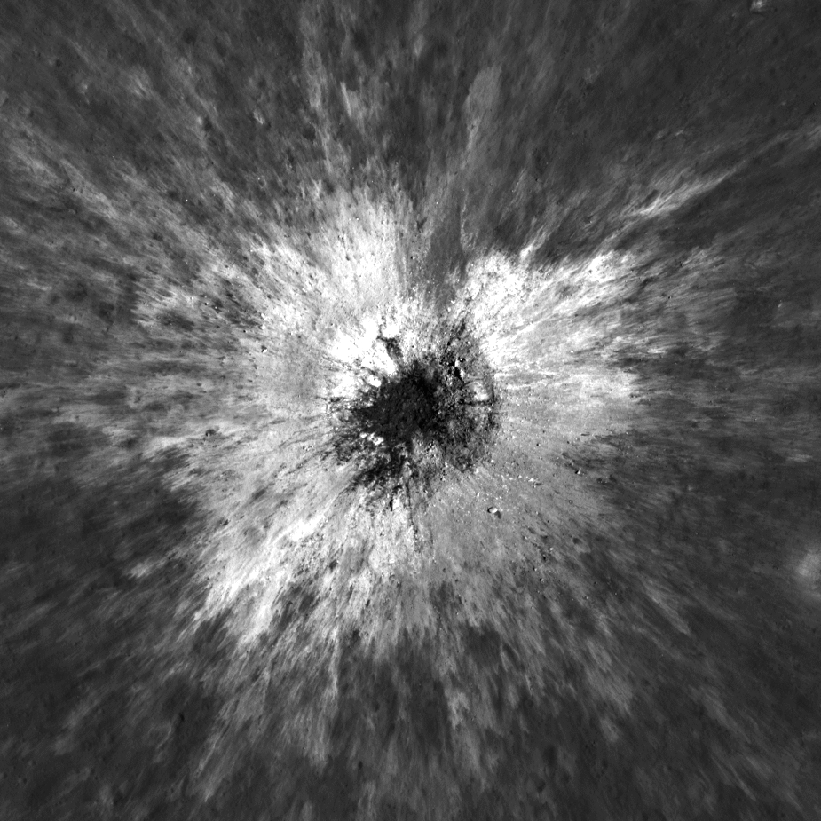 Two images. The before image shows a lunar surface sprinkled with small craters. The after image shows the same location but taken over by a large dark impression surrounding by a ridge that slopes down to the surface.